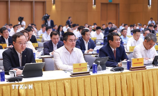 Các đại biểu tham dự Hội nghị Thủ tướng Chính phủ làm việc với doanh nghiệp nhà nước. (Ảnh: Dương Giang/TTXVN) ttxvn-thu-tuong-doanh-nghiep-nha-nuoc-chuyen-doi-so-4.jpg
